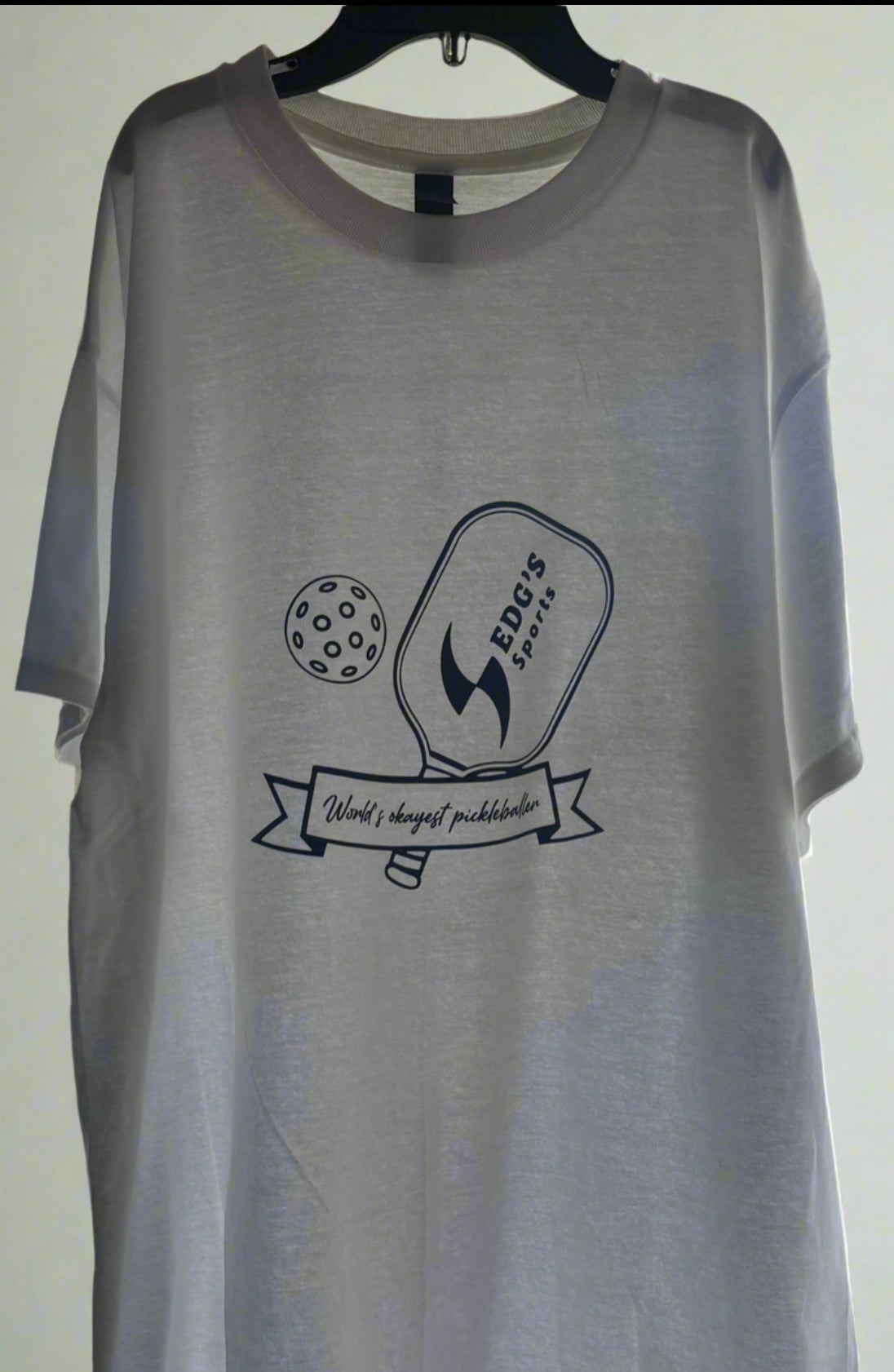“World’s Okayest Pickleballer” Tee. Sedg’s Sports edition